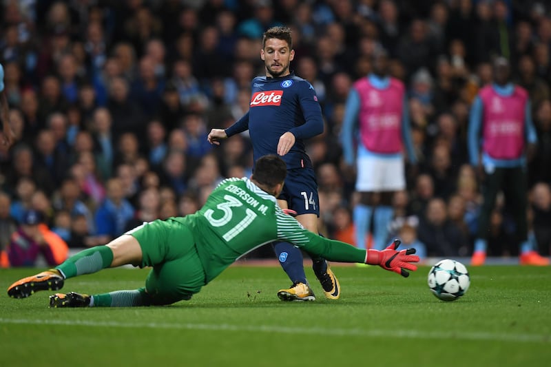 Napoli's Belgian striker Dries Mertens shoots but fails to score past Manchester City's Brazilian goalkeeper Ederson during the UEFA Champions League Group F football match between Manchester City and Napoli at the Etihad Stadium in Manchester, north west England, on October 17, 2017. / AFP PHOTO / Paul ELLIS
