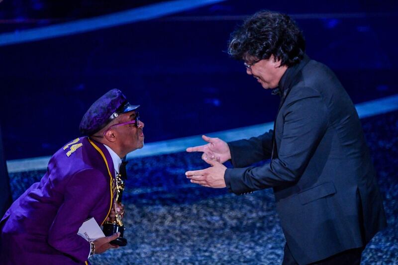 South Korean film director Bong Joon-ho accepts the award for Best Director for 'Parasite' from US director Spike Lee at the 92nd Academy Awards on Sunday, February 9. AFP