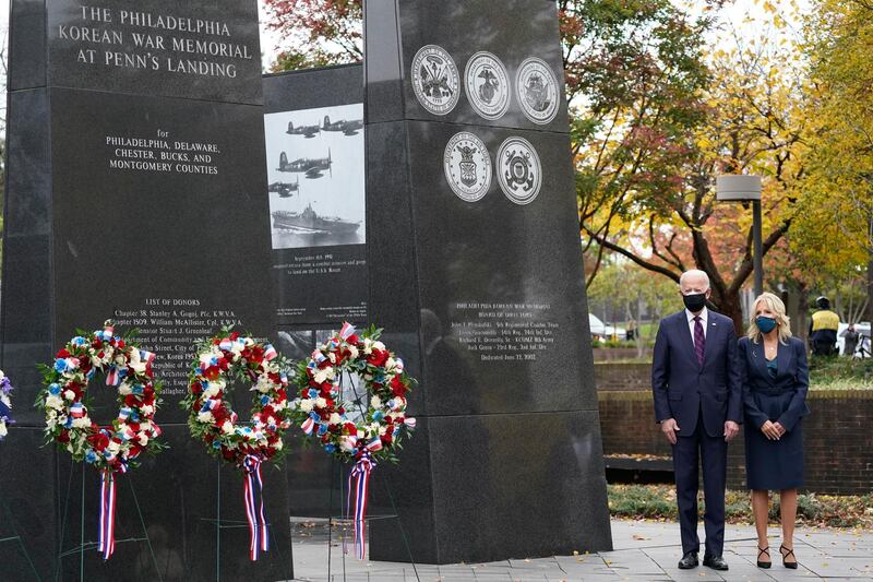 President-elect Joe Biden and Jill Biden, attend a service at the Philadelphia Korean War Memorial at Penn's Landing on Veterans Day,  in Philadelphia.  AP