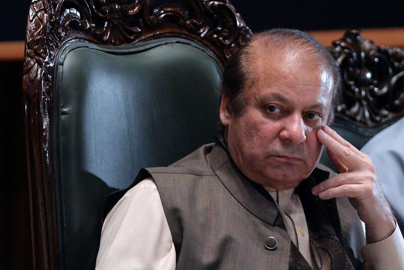 (FILES) In this file photo taken on April 17, 2018 ousted former Pakistani prime minister Nawaz Sharif looks on as he attends a seminar on 'Upholding the Sanctity of Ballot based on the Constitution, Democracy, Supremacy of Parliament and Rule of Law', in Islamabad. Pakistan's former prime minister Nawaz Sharif was sentenced in absentia to 10 years in prison by a corruption court in Islamabad on July 6, lawyers said, dealing a serious blow to his party's troubled campaign ahead of July 25 elections.
 / AFP / AAMIR QURESHI
