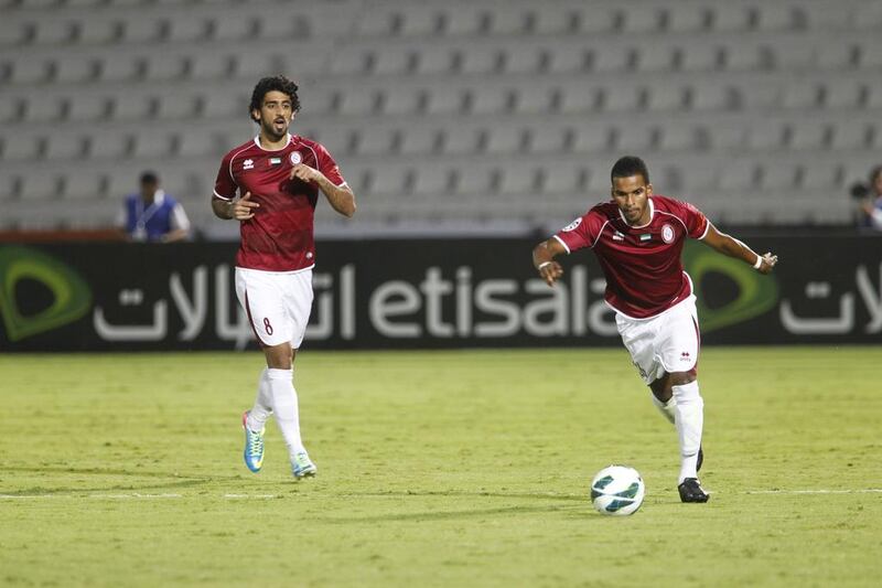 Al Wahda’s Hamdan Al Kamali, left, spent six months on loan at French club Lyon on 2012. Razan Alzayani / The National