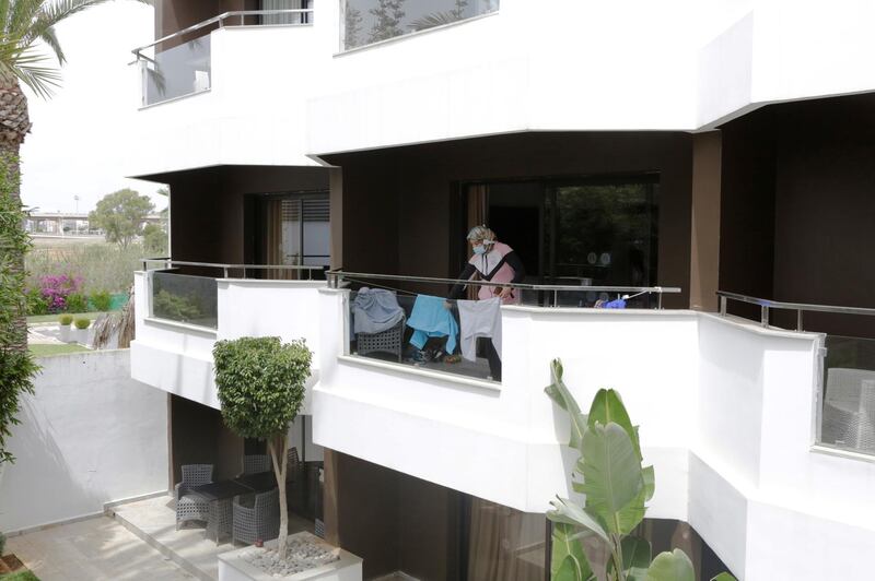 Nurse anaesthetist Najwa Bellamrabet is pictured at her balcony at the hotel Dawliz which is being used to house medical staff  during the coronavirus outbreak in Sale, Morocco. Reuters