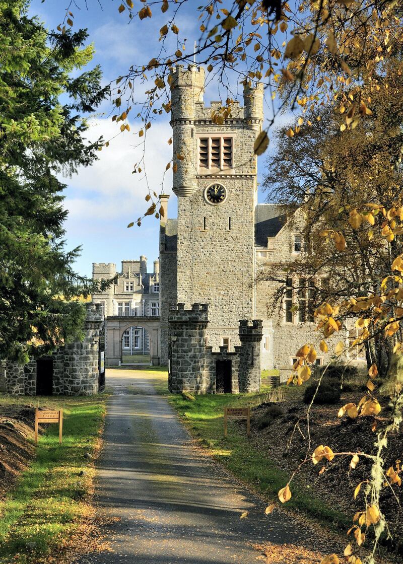 The famous square clock tower at Carbisdale Castle, with clock faces on only three sides at the Duchess of Sutherland's request.