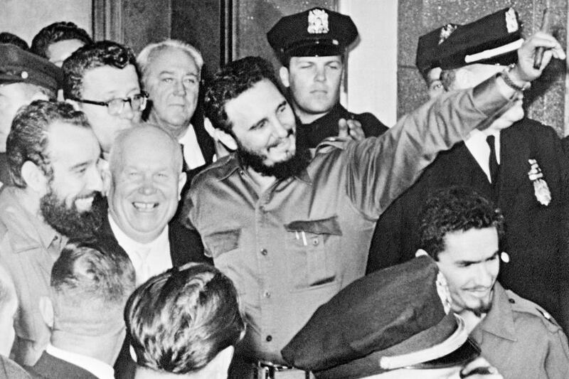 On his first visit to the United Nations after coming to power, Fidel Castro stands with Soviet premier Nikita Khrushchev, centre left, outside the Hotel Theresa in Harlem, New York, on September 20, 1960. AP Photo