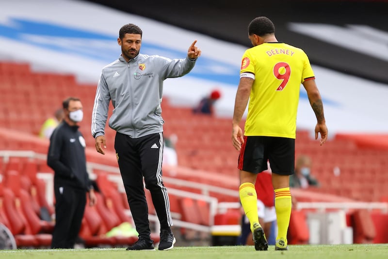 Watford caretaker manager Hayden Mullins, left, on the touchline with Troy Deeney. PA