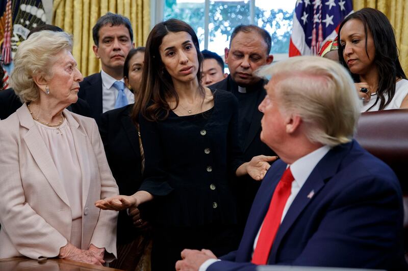 President Donald Trump listens to Nobel Peace Prize winner Nadia Murad, a Yazidi from Iraq, center, as he meets with survivors of religious persecution in the Oval Office of the White House on Wednesday, July 17, 2019, in Washington. The survivors come from countries including, Myanmar, New Zealand, Yemen, China, Cuba, Eritrea, Nigeria, Turkey, Vietnam, Sudan, Iraq, Afghanistan, North Korea, Sri Lanka, Pakistan, Iran and Germany. (AP Photo/Alex Brandon)