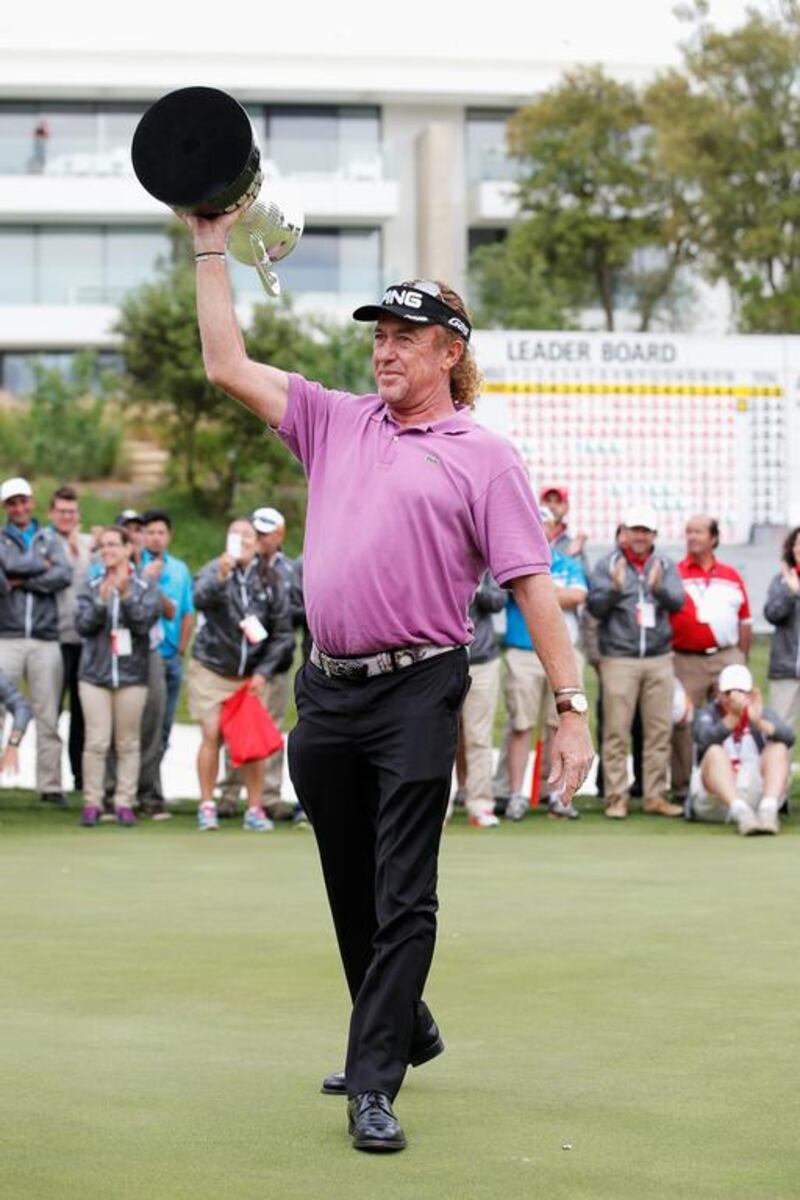 Miguel Angel Jimenez of Spain celebrates with the trophy after winning the Open de Espana held at PGA Catalunya Resort on May 18, 2014 in Girona, Spain. Dean Mouhtaropoulos / Getty Images