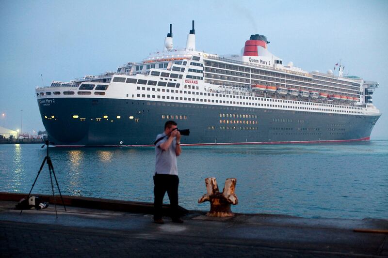Abu Dhabi, United Arab Emirates, January 29, 2013:    A photographer takes pictures while the Queen Mary 2 ocean liner docks for the first time at Mina Zayed in Abu Dhabi on January 29, 2013. Christopher Pike / The National