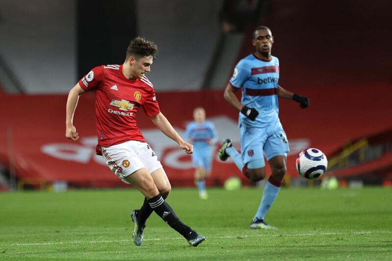 MANCHESTER, ENGLAND - MARCH 14: Daniel James of Manchester United crosses the ball during the Premier League match between Manchester United and West Ham United at Old Trafford on March 14, 2021 in Manchester, England. Sporting stadiums around the UK remain under strict restrictions due to the Coronavirus Pandemic as Government social distancing laws prohibit fans inside venues resulting in games being played behind closed doors. (Photo by Clive Brunskill/Getty Images)