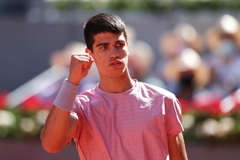 Carlos Alcaraz celebrates winning a point against Rafael Nadal. Getty