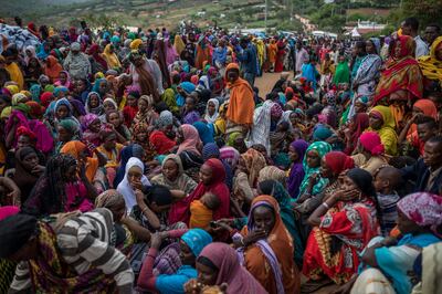 Ethiopian refugee women wait to receive aid from the Kenyan Red Cross on March 19, 2018. According to the Africa Centre for Strategic Studies more than 40 million Africans are forcibly displaced. AFP