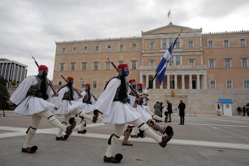 Greek Presidential guards march to the monument of the Unknown Soldier. EPA