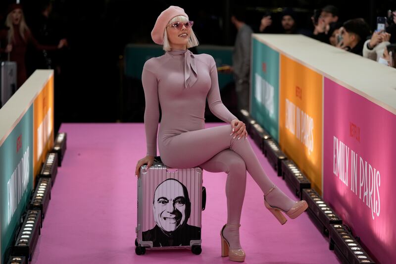 A dancer performs on the pink carpet. AP Photo