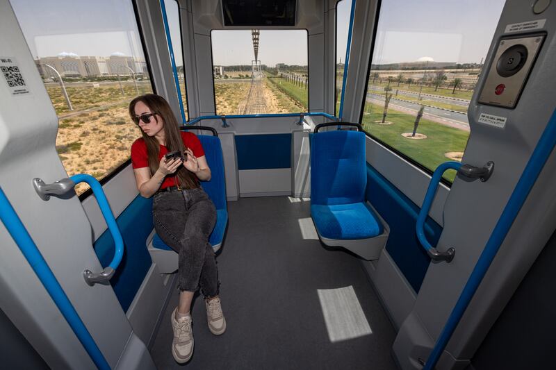 An employee of uSky rides on a pod at the test centre in Sharjah