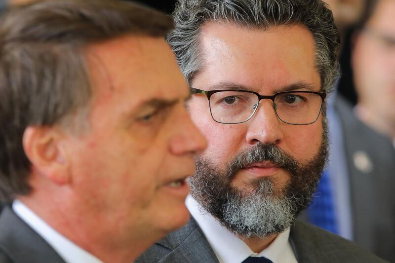 Brazilian President-elect Jair Bolsonaro (L) and his newly appointed Foreign Minister, Brazilian diplomat Ernesto Araujo, are pictured at the headquarters of the transitional government in Brasilia, on November 14, 2018.  It's the eighth ministerial appointment Bolsonaro has made since winning the presidential election at the end of last month.
 / AFP / Sergio LIMA
