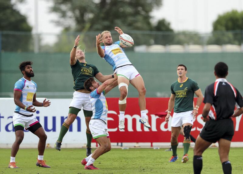 Dubai, United Arab Emirates - December 07, 2019: James Little (L) and Lewis Gjaltema (M) of Speranza take on Werner Kok of South Africa in the game between South Africa 7s Academy and Speranza 22 in the Int Invitational at the HSBC rugby sevens series 2020. Saturday, December 7th, 2019. The Sevens, Dubai. Chris Whiteoak / The National