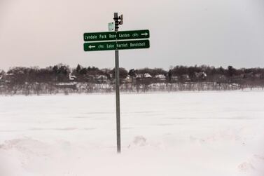 A frozen road sign under the wind chill at frozen Lake Harriet in Minneapolis, Minnesota on January 29, 2019. The polar vortex is here -- tens of millions of people in the US braced on January 29, 2019, for a deep arctic chill, which authorities say could be life-threatening. Sub-zero temperatures already blanketing parts of Canada were already sweeping across the US Midwest and towards the East Coast. / AFP / Kerem Yucel