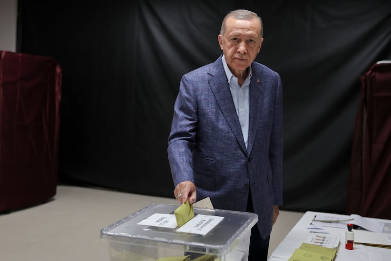 Mr Erdogan casts his vote in Istanbul on Sunday. Getty