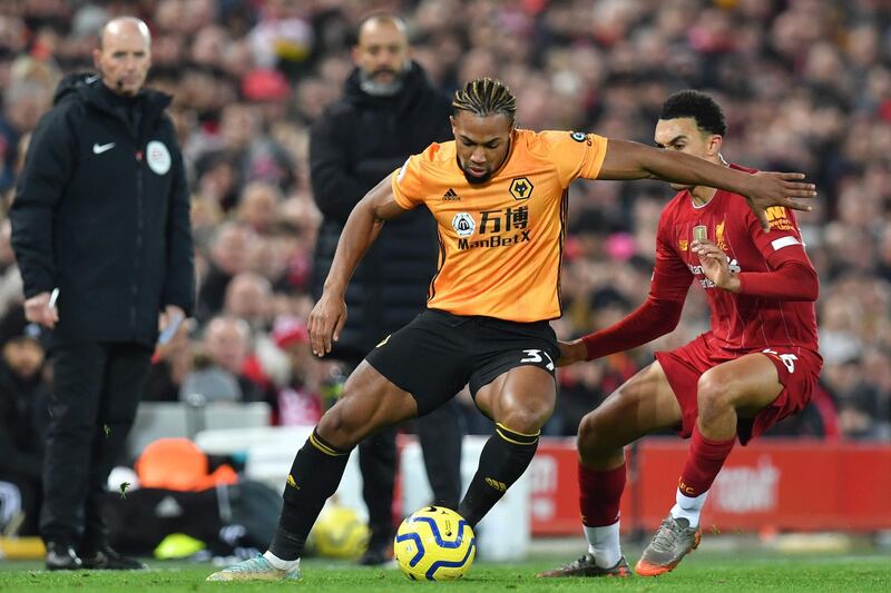 Wolverhampton Wanderers' Spanish striker Adama Traore (L) takes on Liverpool's English defender Trent Alexander-Arnold (R) during the English Premier League football match between Liverpool and Wolverhampton Wanderers at Anfield in Liverpool, north west England, on December 29, 2019.  - RESTRICTED TO EDITORIAL USE. No use with unauthorized audio, video, data, fixture lists, club/league logos or 'live' services. Online in-match use limited to 120 images. An additional 40 images may be used in extra time. No video emulation. Social media in-match use limited to 120 images. An additional 40 images may be used in extra time. No use in betting publications, games or single club/league/player publications.
 / AFP / Paul ELLIS / RESTRICTED TO EDITORIAL USE. No use with unauthorized audio, video, data, fixture lists, club/league logos or 'live' services. Online in-match use limited to 120 images. An additional 40 images may be used in extra time. No video emulation. Social media in-match use limited to 120 images. An additional 40 images may be used in extra time. No use in betting publications, games or single club/league/player publications.
