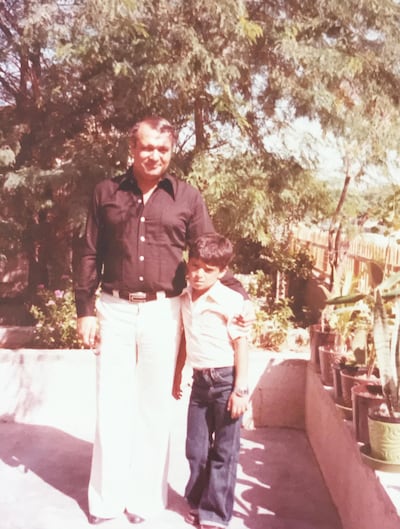 Ali Khaled with his father at their home in Khalidiya in the late 1970s. Ali Khaled