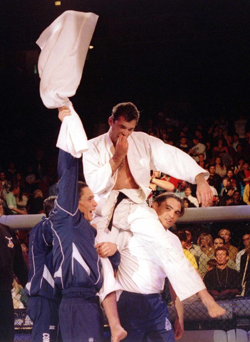 DENVER, CO - NOVEMBER 12: Royce Gracie (USA), 4th-degree Jiu-Jitsu Black Belt, is lifted by members of his corner after beating Gerard Gordeau (NET) to win the Ultimate Fighting Championships UFC 1 on November 12, 1993 at the McNichols Sports Arena in Denver, Colorado.  (Photo by Holly Stein/Getty Images)