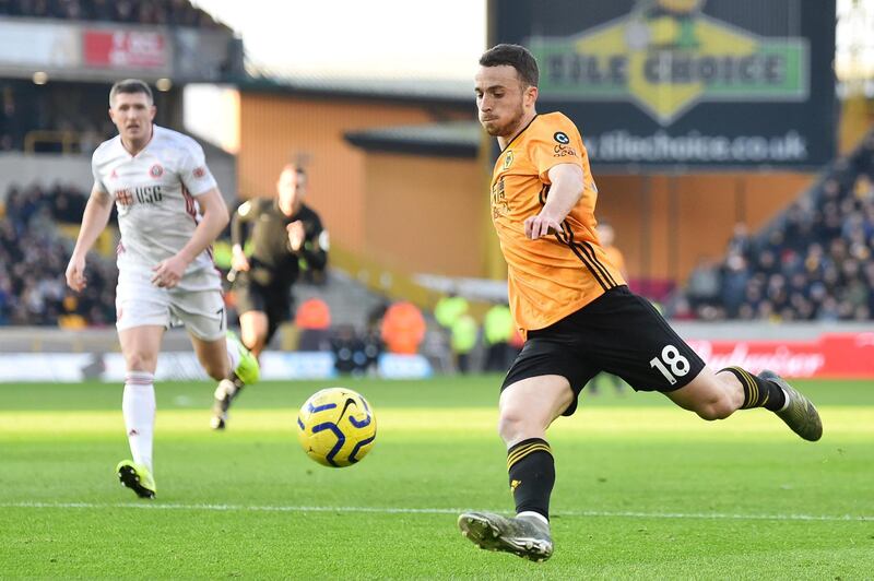 WOLVERHAMPTON, ENGLAND - DECEMBER 01: Diogo Jota of Wolverhampton Wanderers takes a shot during the Premier League match between Wolverhampton Wanderers and Sheffield United at Molineux on December 01, 2019 in Wolverhampton, United Kingdom. (Photo by Nathan Stirk/Getty Images)