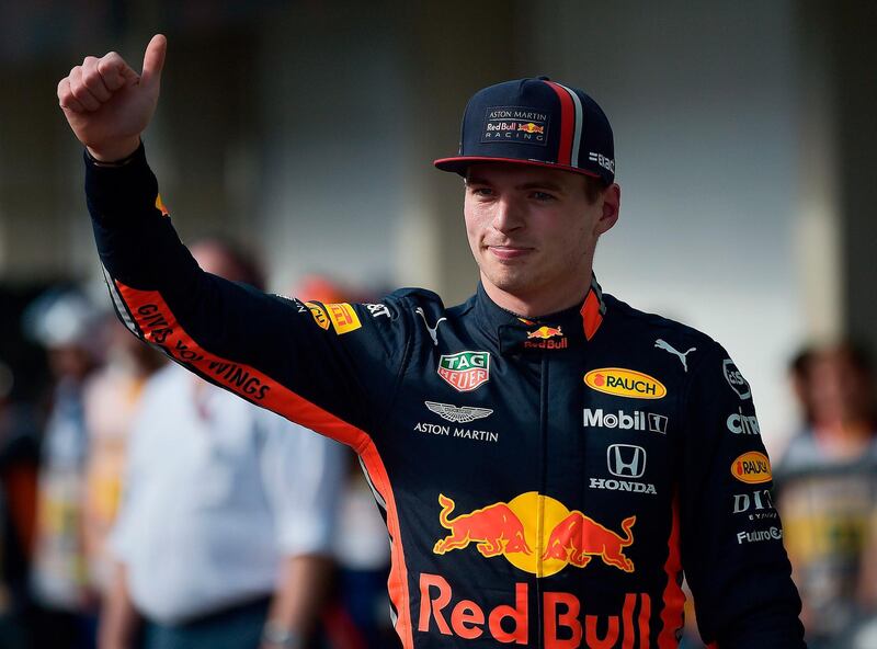 Red Bull's Dutch driver Max Verstappen waves after taking pole position for the F1 Brazil Grand Prix in the qualifying session at the Interlagos racetrack in Sao Paulo, Brazil, on November 16, 2019. / AFP / Carl DE SOUZA
