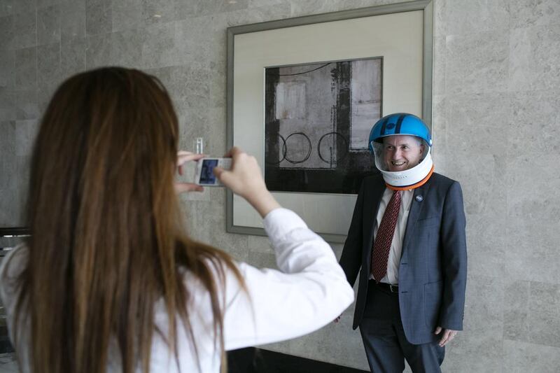 Professor Tim McGloughlin, Chair Biomedical Engineering, Khalifa University, poses with a space helmet. Silvia Razgova for The National