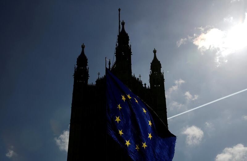 An EU flag waves outside the Houses of Parliament in London, Britain, March 26, 2019. REUTERS/Alkis Konstantinidis     TPX IMAGES OF THE DAY