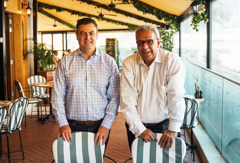 Cookbook author Flavel Monteiro, right, with Naim Maadad of Gates Hospitality