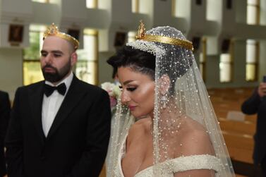 Laura Daher and Elie Abi Daher are married in a quiet service at St Therese Church in Abu Dhabi on August 17. They cancelled plans for a service in Lebanon after places of worship opened in the UAE last month with limited capacity and observing social distancing norms. Courtesy: Laura Daher and Elie Abi Daher