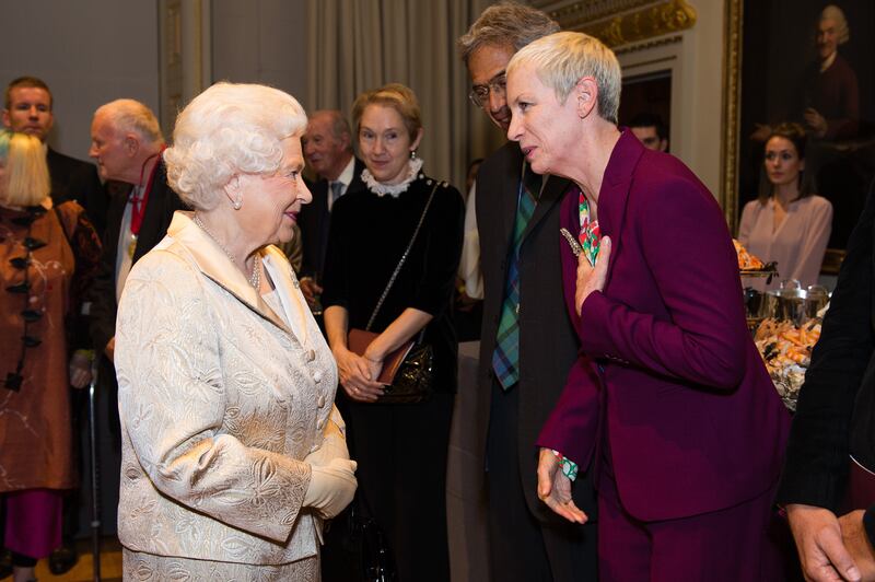 Queen Elizabeth and former Eurythmics singer Annie Lennox attend a reception at the Royal Academy of Arts in London in 2016. Getty Images