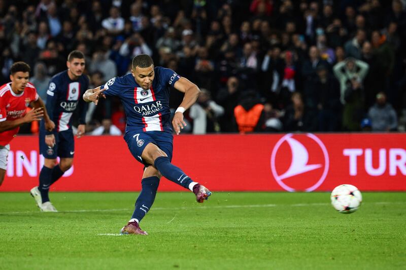 Paris Saint-Germain's French forward Kylian Mbappe scores the opening goal in the Champions League  against Benfica, at the Parc des Princes Stadium, on October 11, 2022. AFP