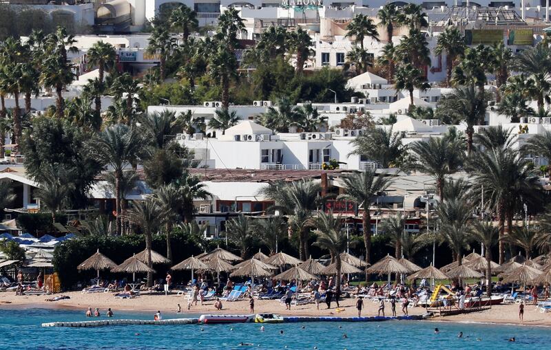 FILE PHOTO: Tourists enjoy the water on a beach at the Red Sea resort of Sharm el-Sheikh, south of Cairo, Egypt December 15, 2018. Picture taken December 15, 2018. REUTERS/Amr Abdallah Dalsh/File Photo