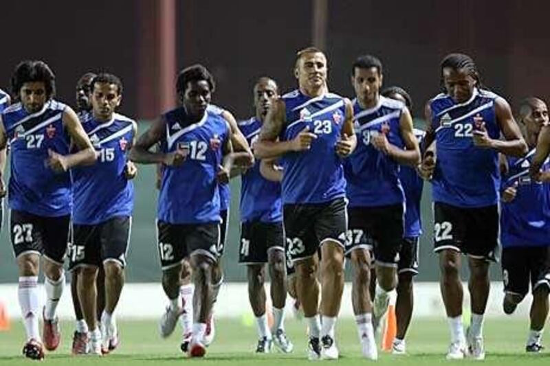 Fabio Cannavaro, centre, takes part in training with his new Al Ahli teammates at Rashid Stadium in Dubai last night.