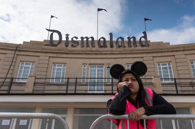 A steward is seen outside Bansky's 'Dismaland' exhibition, which opened recently at a derelict seafront lido in Weston-Super-Mare, England. Matthew Horwood / Getty Images
