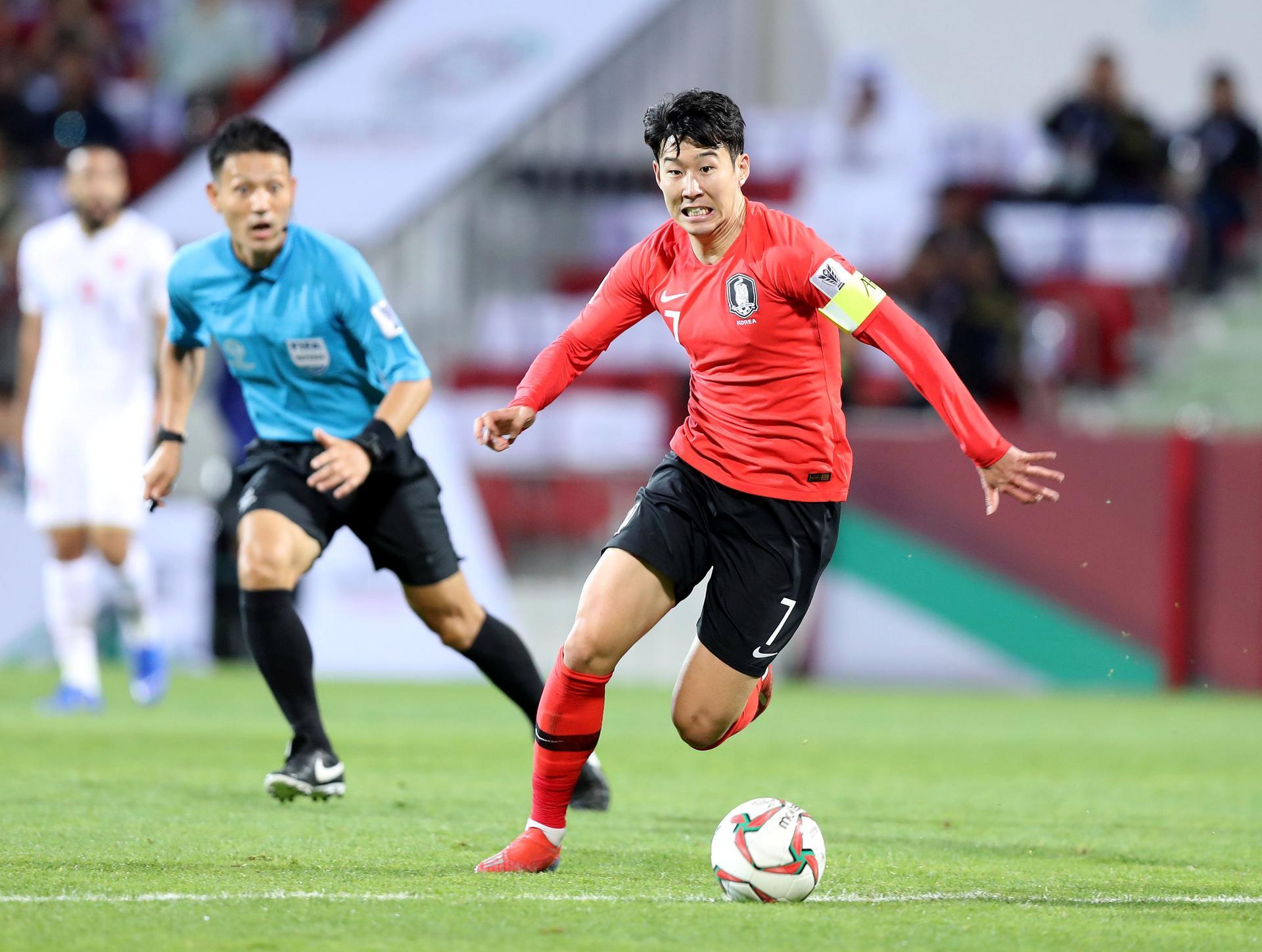 Dubai, United Arab Emirates - January 22, 2019: Son Heung-min of South Korea competes in the game between South Korea and Bahrain in the Asian Cup 2019. Tuesday, January 22nd, 2019 at Rashid Stadium, Dubai. Chris Whiteoak/The National