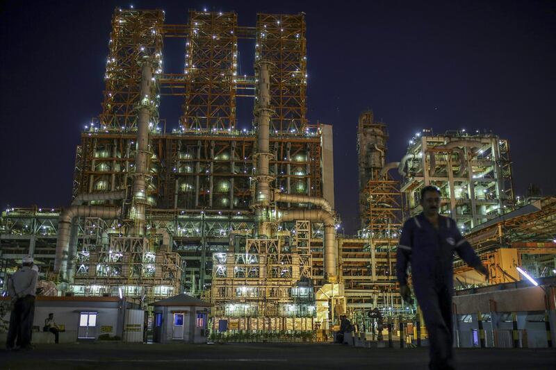 The Vadinar Refinery complex operated by Nayare Energy Ltd., formerly known as Essar Oil Ltd. and now jointly owned by Rosneft Oil Co. and Trafigura Group Pte., stands illuminated at night near Vadinar, Gujarat, India, on Thursday, April 26, 2018. The refinery was the crown jewel in a blockbuster $13 billion acquisition that, at the time, represented the largest foreign direct investment in India's history. The deal marked Trafigura's coming of age. Photographer: Dhiraj Singh/Bloomberg