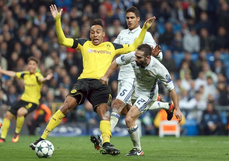 Dortmund's Pierre-Emerick Aubameyang vies for possession with Real Madrid's Raphael Varane and Daniel Carvajal. Friso Gentsch / EPA