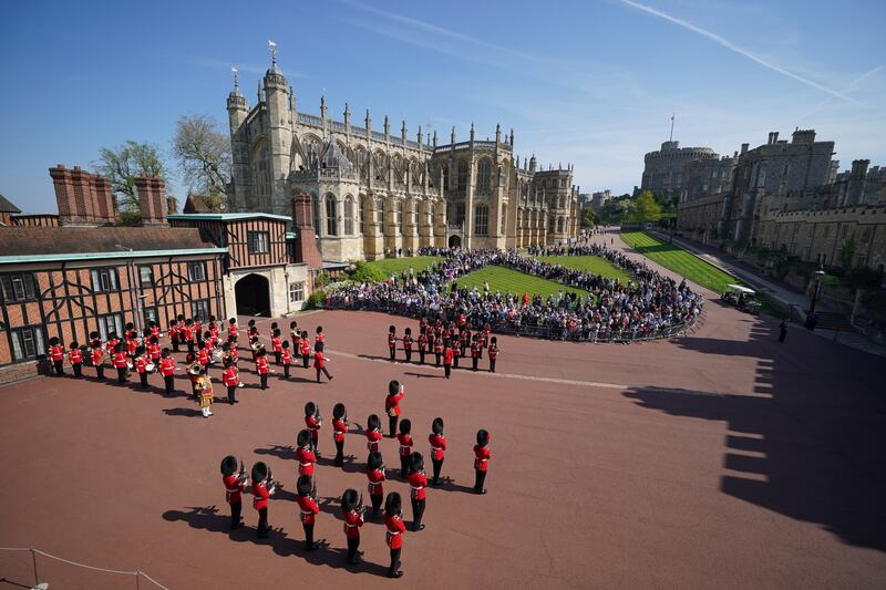 The Band of the Coldstream Guards play Happy Birthday to mark the 96th birthday of Queen Elizabeth II, during the Changing the Guard at Windsor Castle. PA