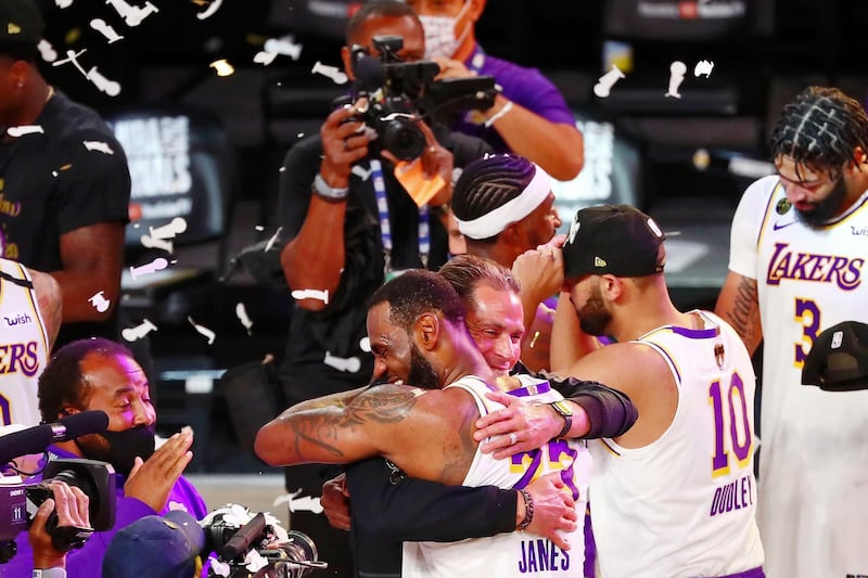 Lakers' forward LeBron James hugs general manager Rob Pelinka. USA TODAY Sports