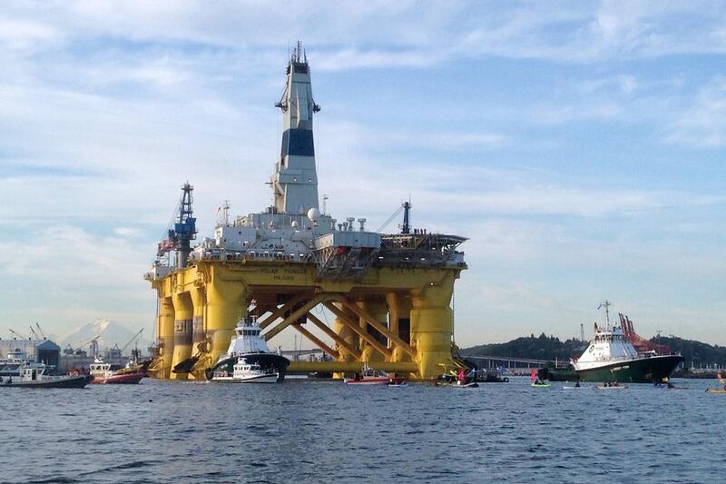 Kayakers try to block the departure of the Shell Oil Polar Pioneer rig platform to be used in offshore drilling operations in Alaska as it moved from Elliott Bay in Seattle, Washington. Shell on September 28, 2015 scrapped its controversial offshore exploration in Alaska after failing to find sufficient quantities of oil and gas, and also cited high costs and challenging regulation. Tim Exton / AFP