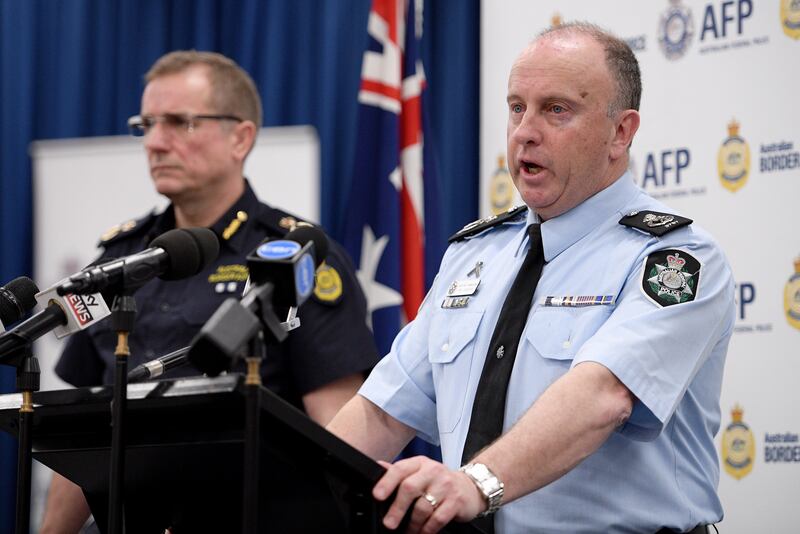 Australian Federal Police assistant commissioner Neil Gaughan, right addresses the media after making the arrests. Dan Himbrechts / EPA