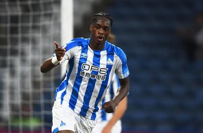 HUDDERSFIELD, ENGLAND - JULY 25: Terence Kongolo of Huddersfield celebrates after scoring during a pre-season friendly match between Huddersfield Town and Olympique Lyonnais at John Smith's Stadium on July 25, 2018 in Huddersfield, England. (Photo by Nathan Stirk/Getty Images)