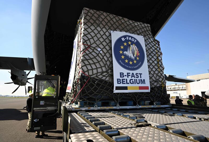 Belgian Air Force personnel load a cargo plane with humanitarian aid for Palestinian civilians in Gaza, at the military airport in Melsbroek. AFP