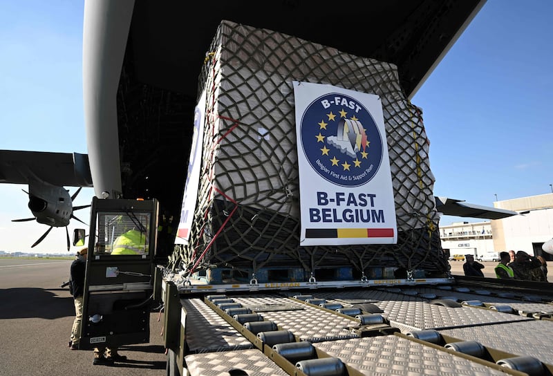 Belgian Air Force personnel load a cargo plane with humanitarian aid for Palestinian civilians in Gaza, at the military airport in Melsbroek. AFP