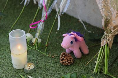 Well-wishers have left toys, flowers and candles at the park. Reuters 