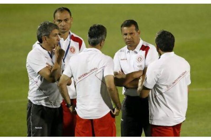 Celso Roth, second right, speaks with his assistants in Abu Dhabi this week. Hassan Ammar / AP Photo