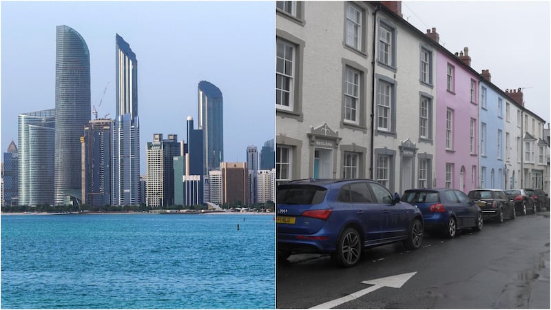 Abu Dhabi, left, boasts a modern skyline, while Aberdovey has seaside charm. Reuters, James Langton for The National