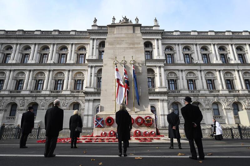 People stand silent during a ceremony at the Cenotaph on Whitehall in remembrance to Britain's war dead in London, Britain. EPA